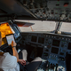 An Iberia Airlines pilot touches the screen of an iPad during a demonstration inside a cockpit of a passenger plane at Terminal 4 of Madrid's Adolfo Suarez Barajas airport
